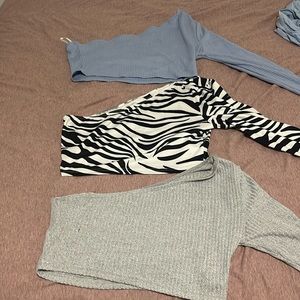 Three one sleeve crop tops